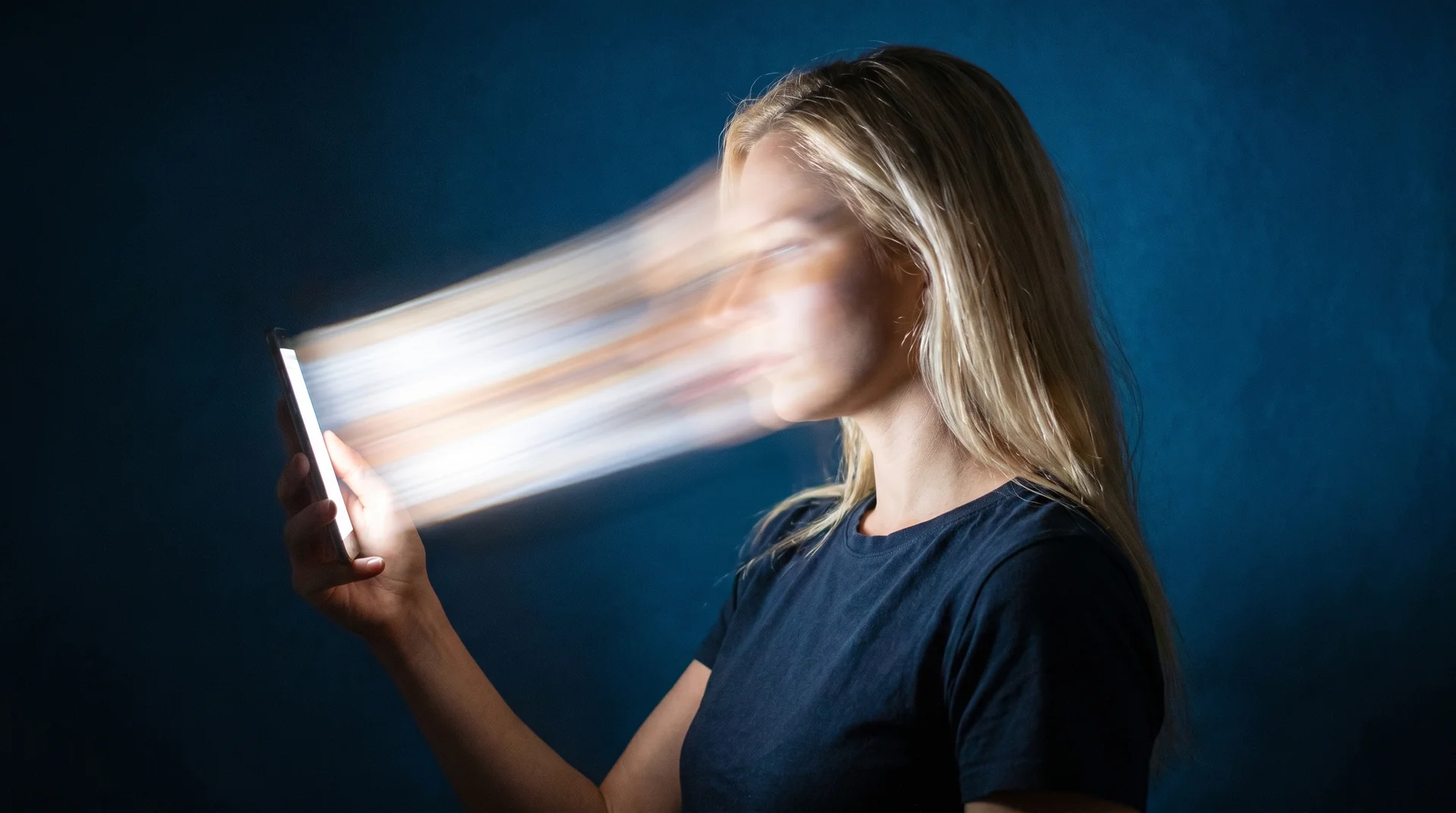 Person looking confused while holding their phone trying to remember something they just read